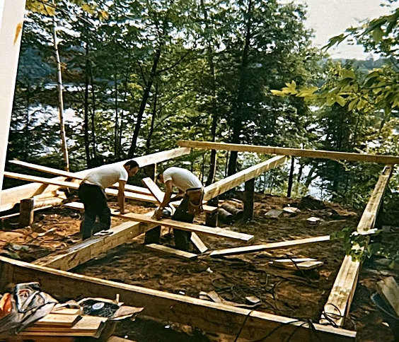 Laying out the original posts and foundation beams. The Lodge sits on these very beams today; a few of the uprights have been replaced since…